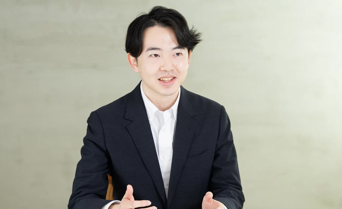 購買管理システム開発に携わる田村さん
